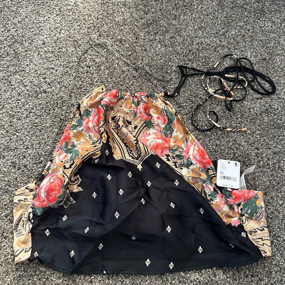 Absolutely stunning nwt free people halter top size medium.